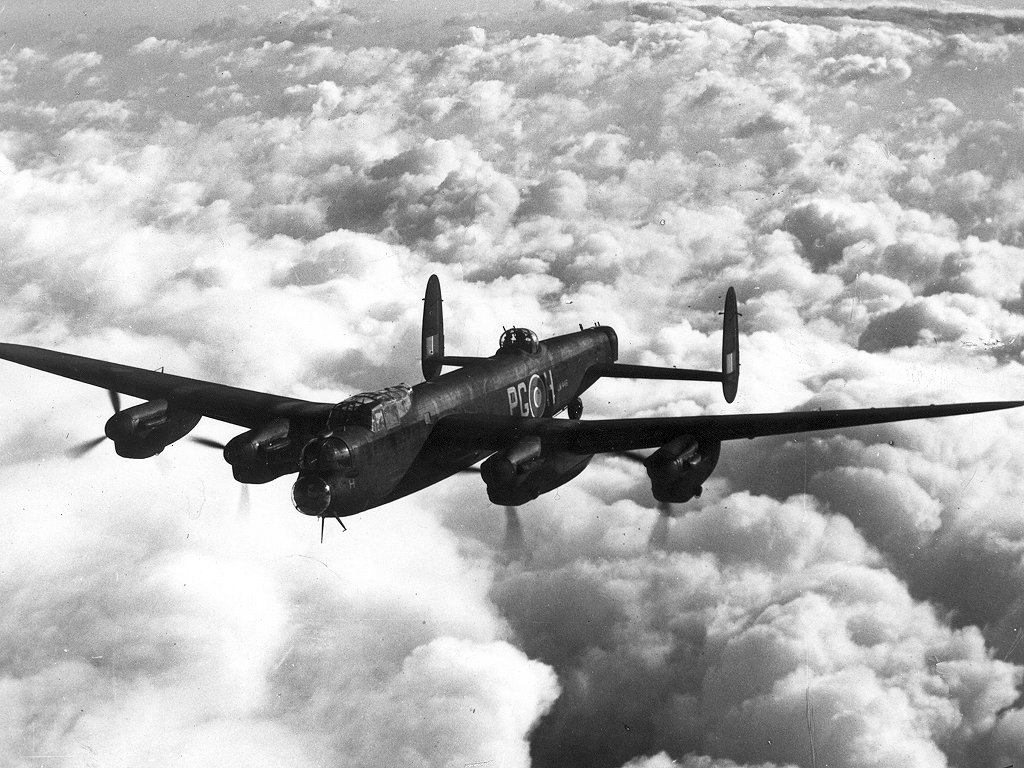 An inflight image of a four-engined bomber aircraft · Avro Lancaster ...