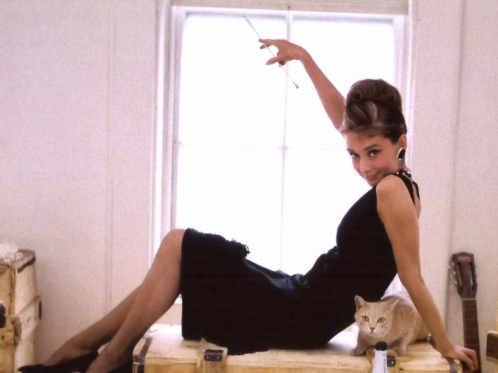In Breakfast at Tiffany's, Holly Golightly (Audrey Hepburn) evades her murky past by adopting a glamorous, new identity. There are many beautiful and witty ...