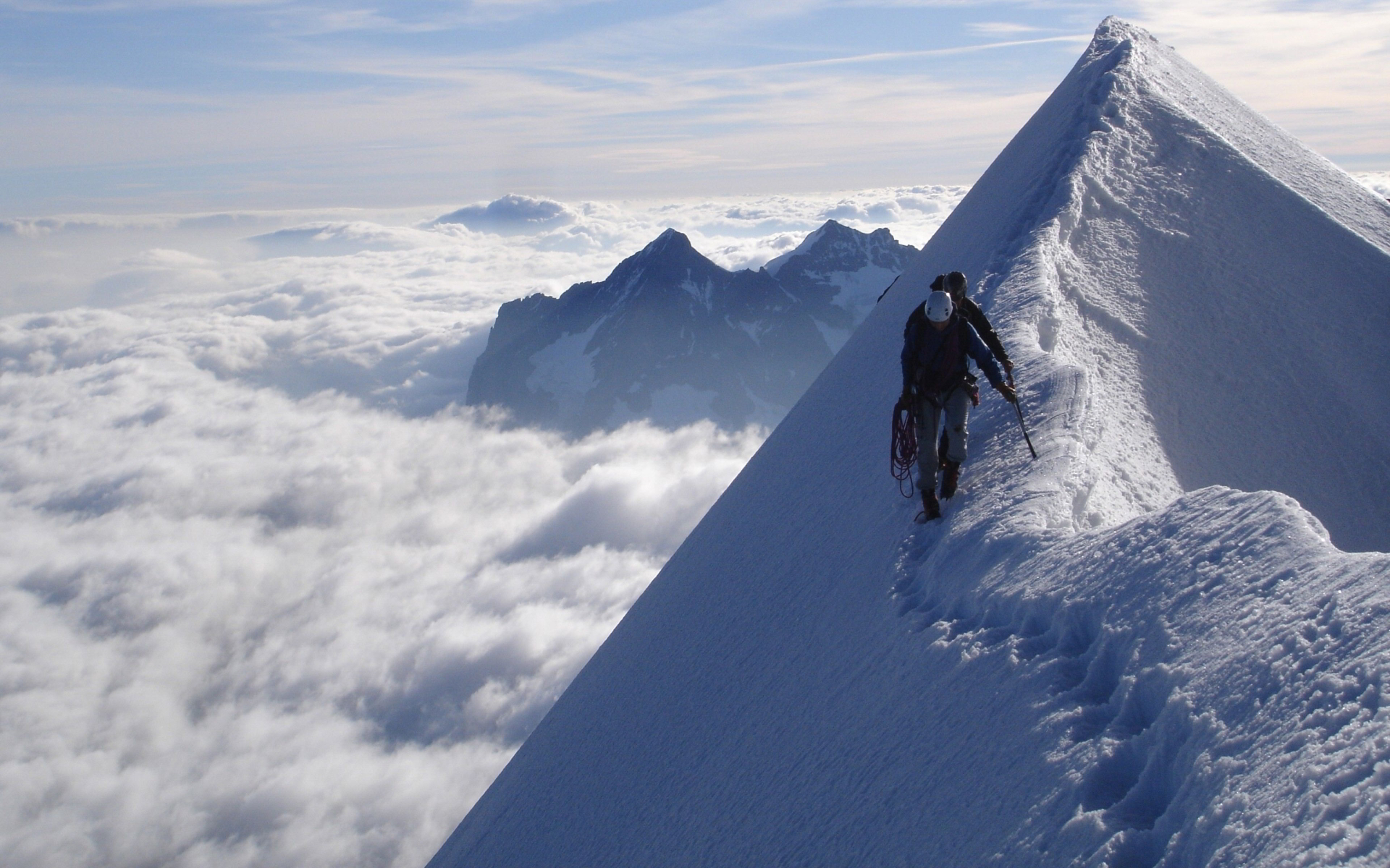 Climber snowy mountain top