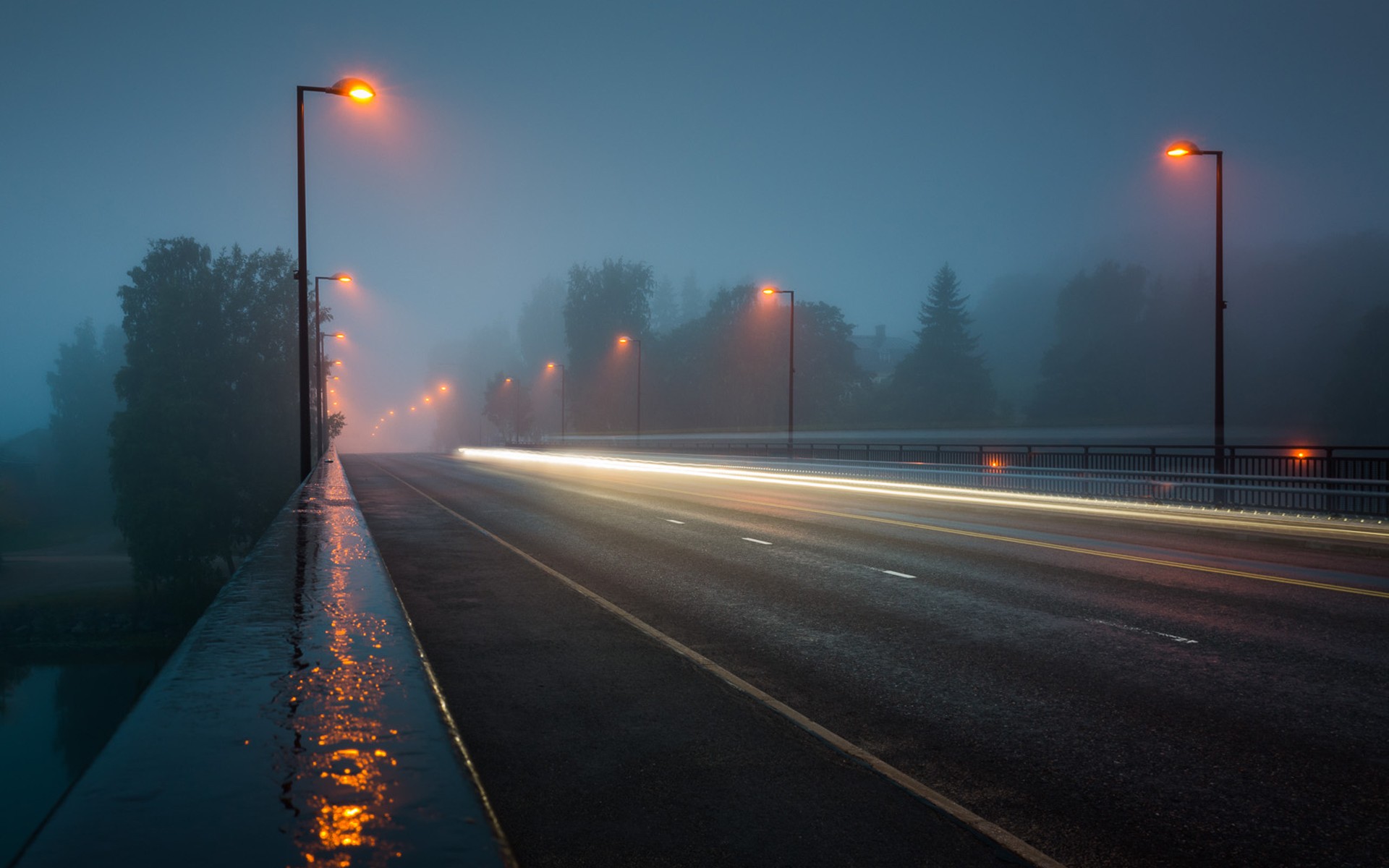 Foggy night bridge street lights