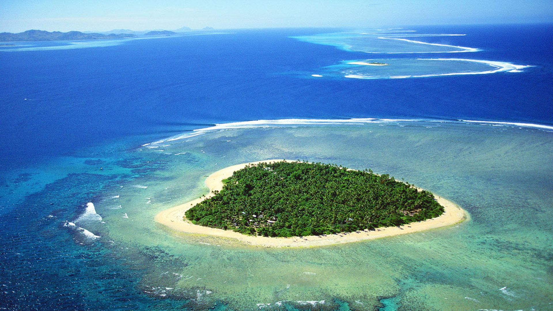 This is the island of Tavarua in Fiji, five miles by boat from the main island of Viti Levu. It is 29 acres in size and surrounded by a coral reef.