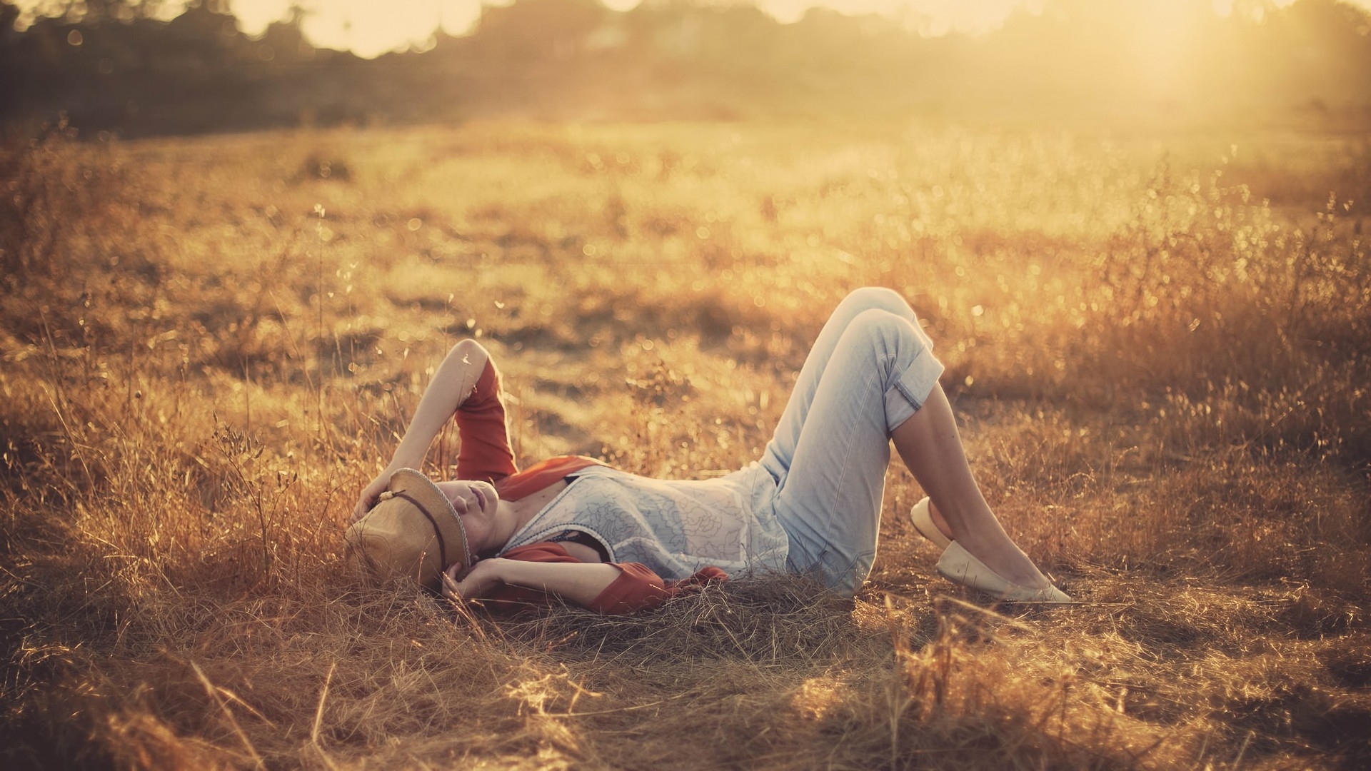 1920x1080 Wallpaper girl, grass, light, sunset, field, hat, mood