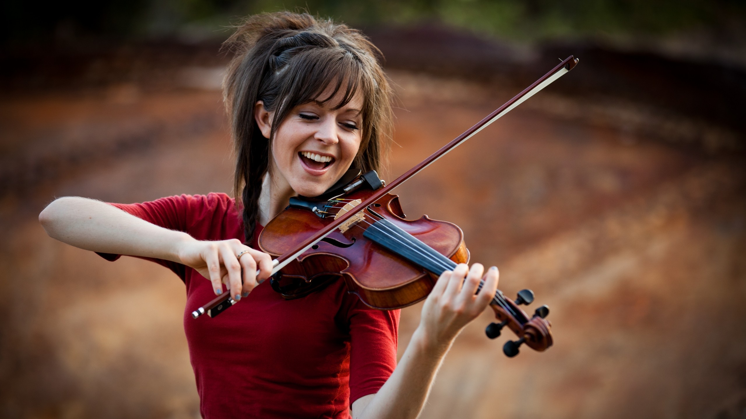 Her name is Lindsey Stirling & she is an incredible violinist famous for her choreographed violin performances! You heard me right!