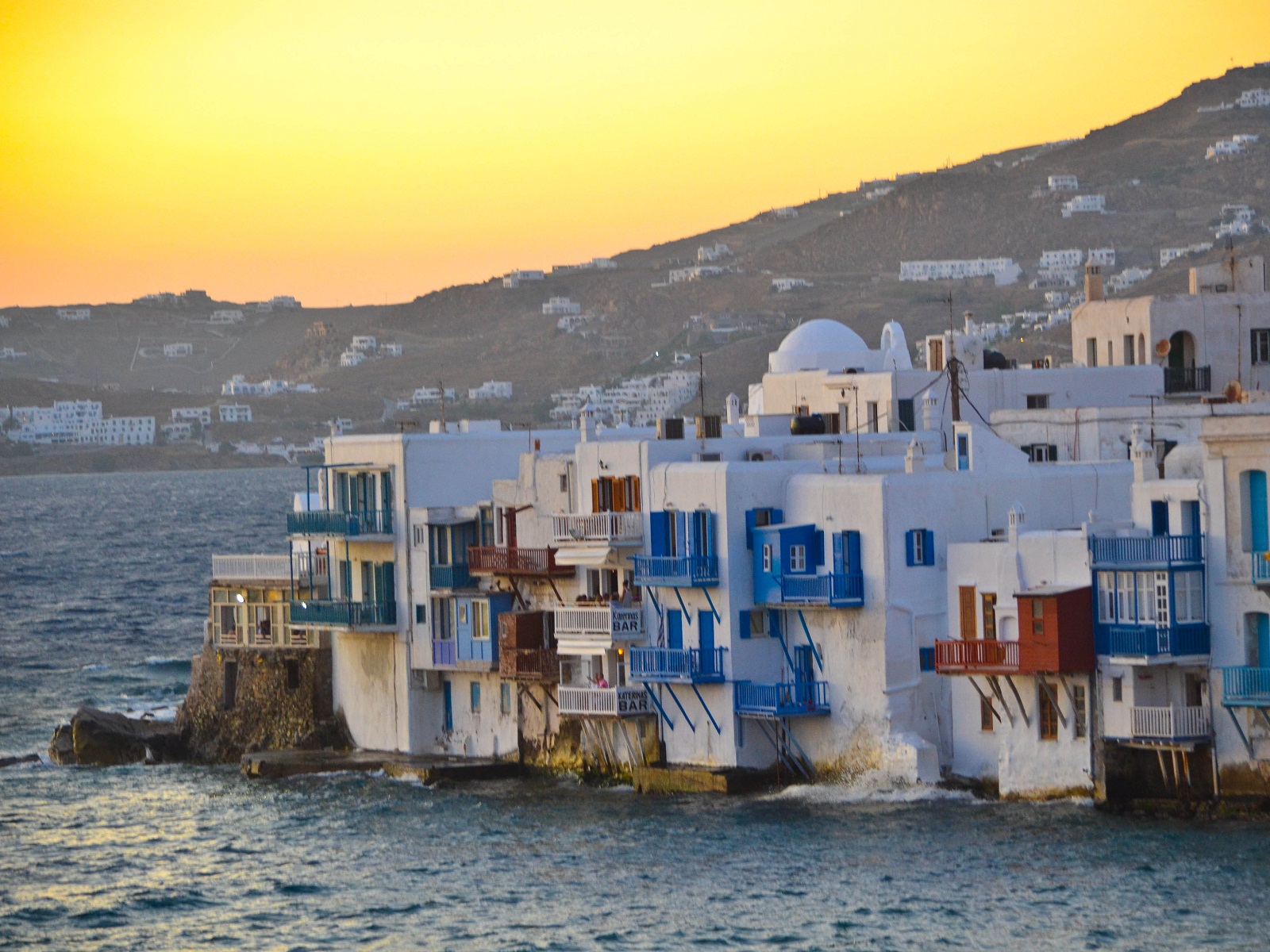 “In Greek mythology Mykonos was the location of the battle between Zeus and the Titans , and the island was named in honor of Apollo's grandson Mykons.