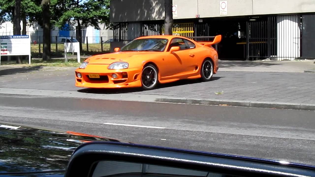 Orange Toyota Supra Driving Out Of Garage