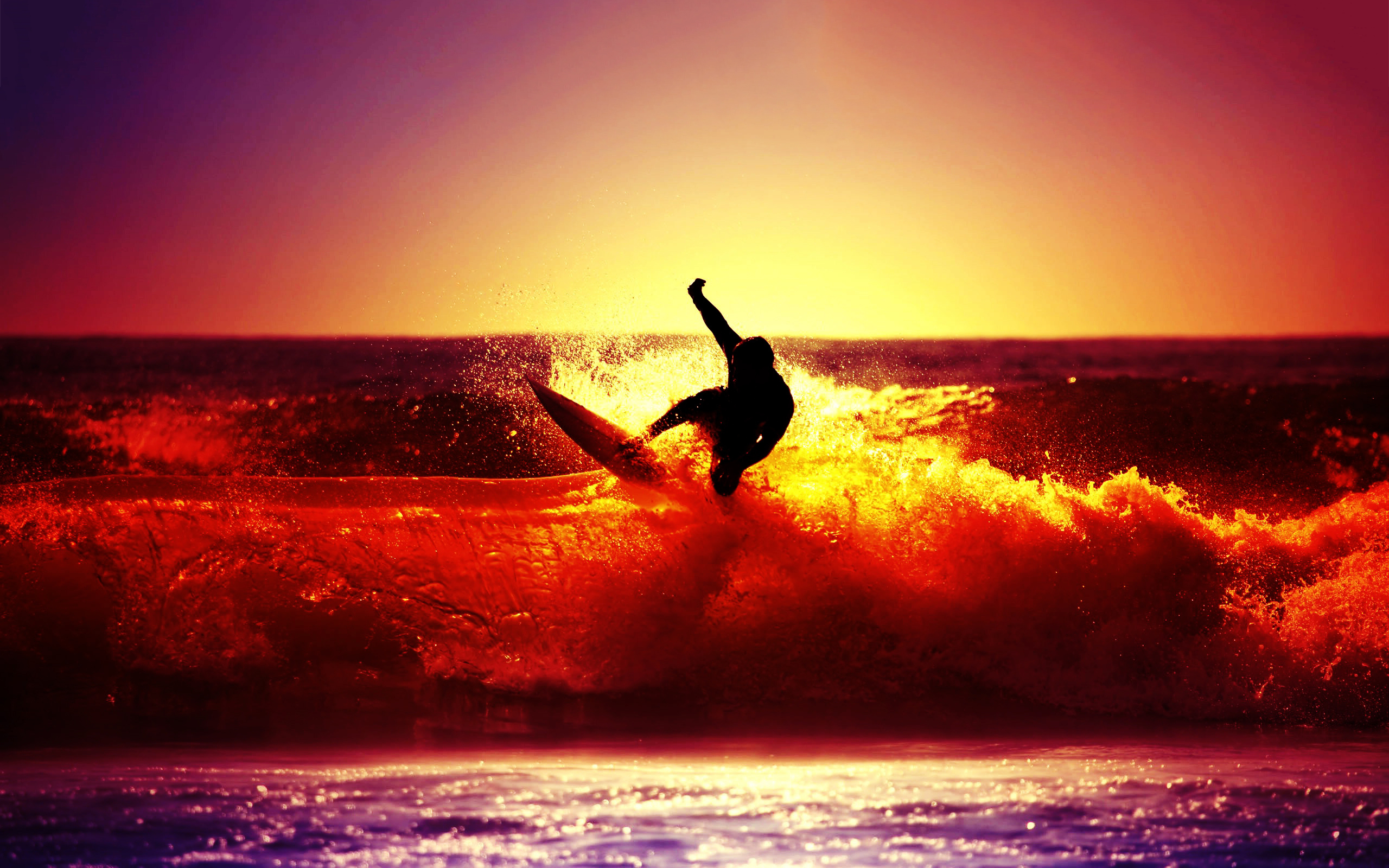 Surfing ocean sunset