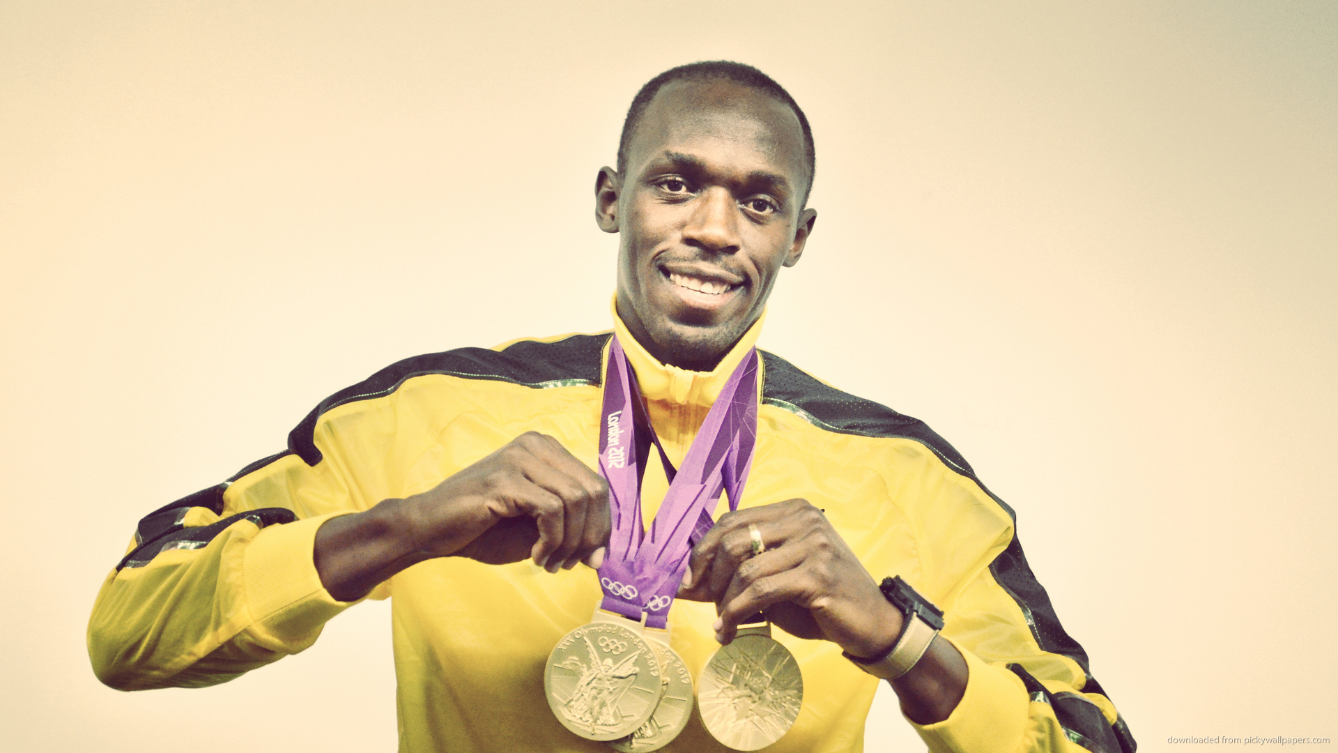 Usain Bolt holds three golden medals picture