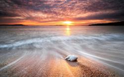Beach stone sunset
