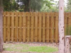 Both sides of the fence look the same. The posts are seen on the inside. This fence has diagonal visibility and allows for air to flow through the fence.