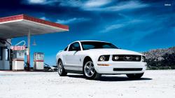 White Ford Mustang Wallpaper on Gas Station