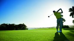 Download Man Hits The Golf Ball Wallpaper