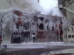 Photo: Iced-over remains of Minneapolis apartment building after fire - @kare11