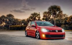 Download the following Stunning Red Volkswagen GTI Wallpaper 42975 by clicking the orange button positioned underneath the "Download Wallpaper" section.