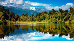 Wallpaper Tags: trees reflection mountains river serene clouds