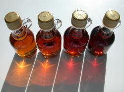 Old US maple syrup grades, left to right: Grade A Light Amber ("Fancy"), Grade A Medium Amber, Grade A Dark Amber, ...