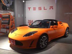A Tesla Roadster on public display at a Japan-based showroom. It is also being charged.